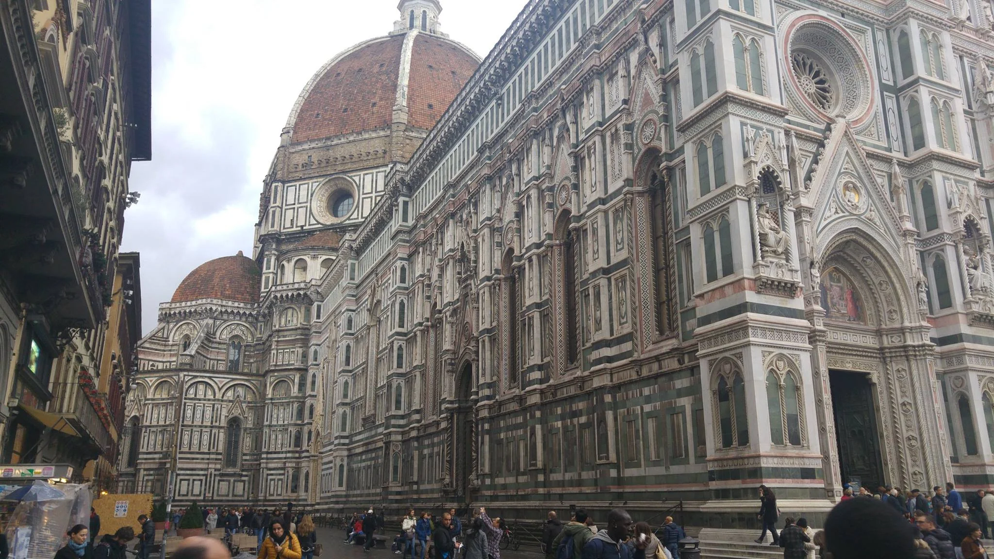 The marble facade and dome of Florence Cathedral from the street
