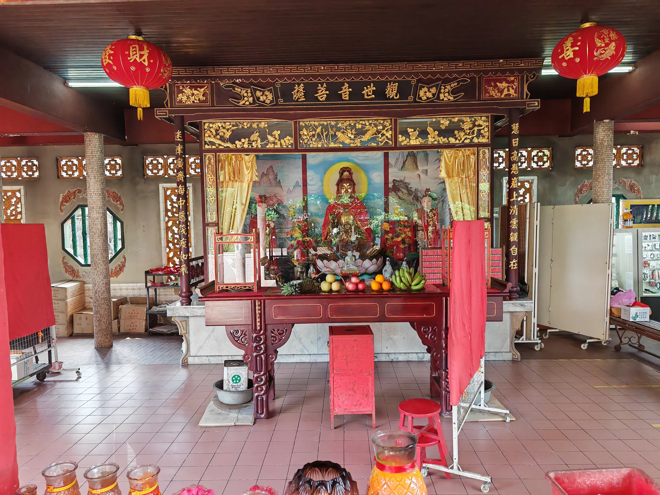 An ornate shrine with red lanterns in Penang