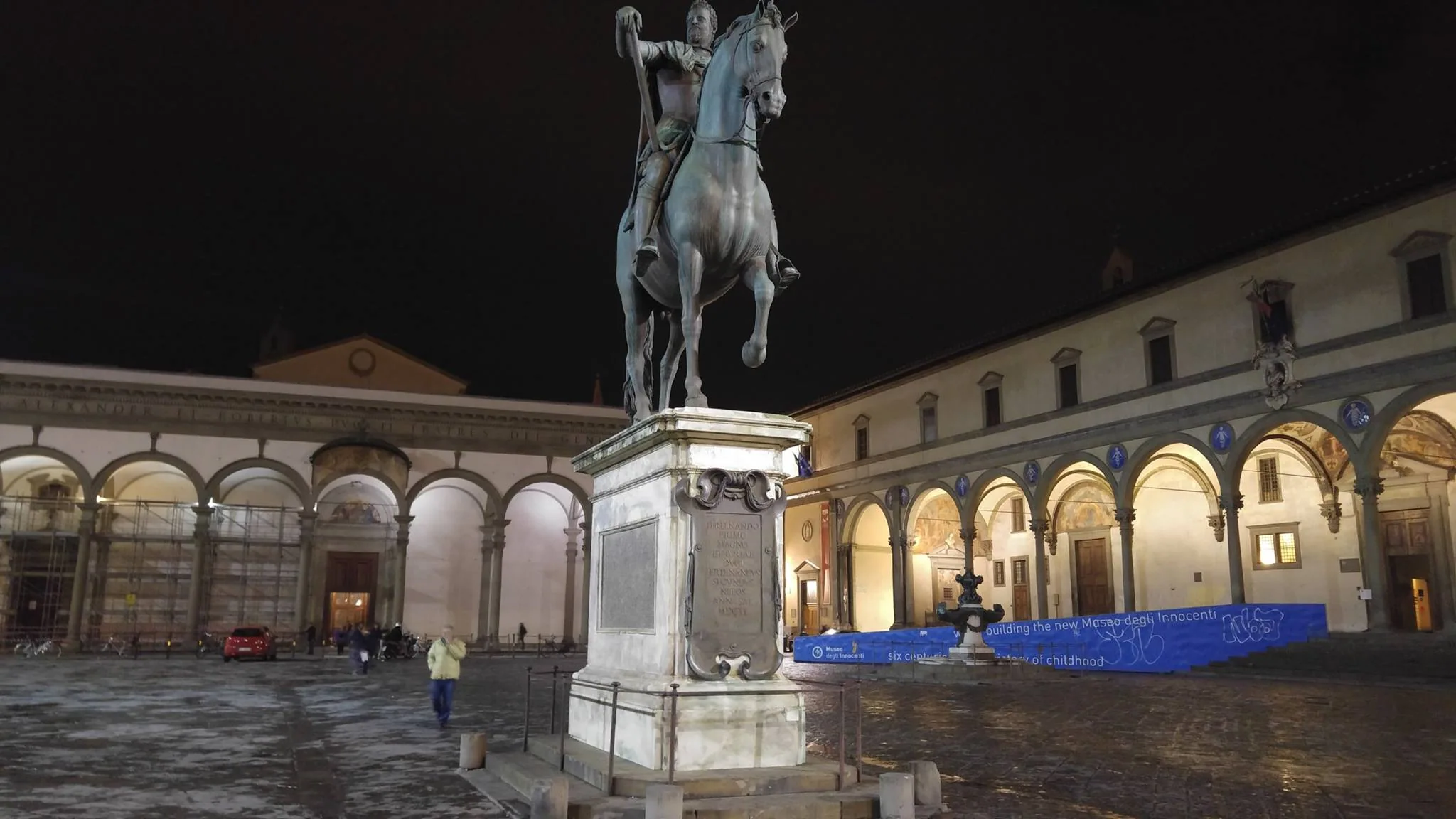 An equestrian statue in an arcaded Florence square
