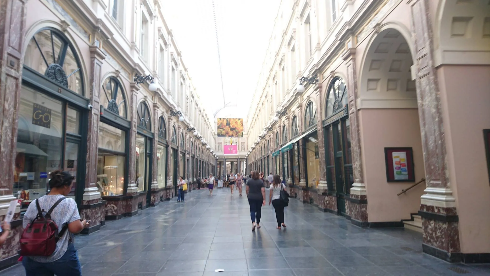 A bright covered shopping arcade in Brussels