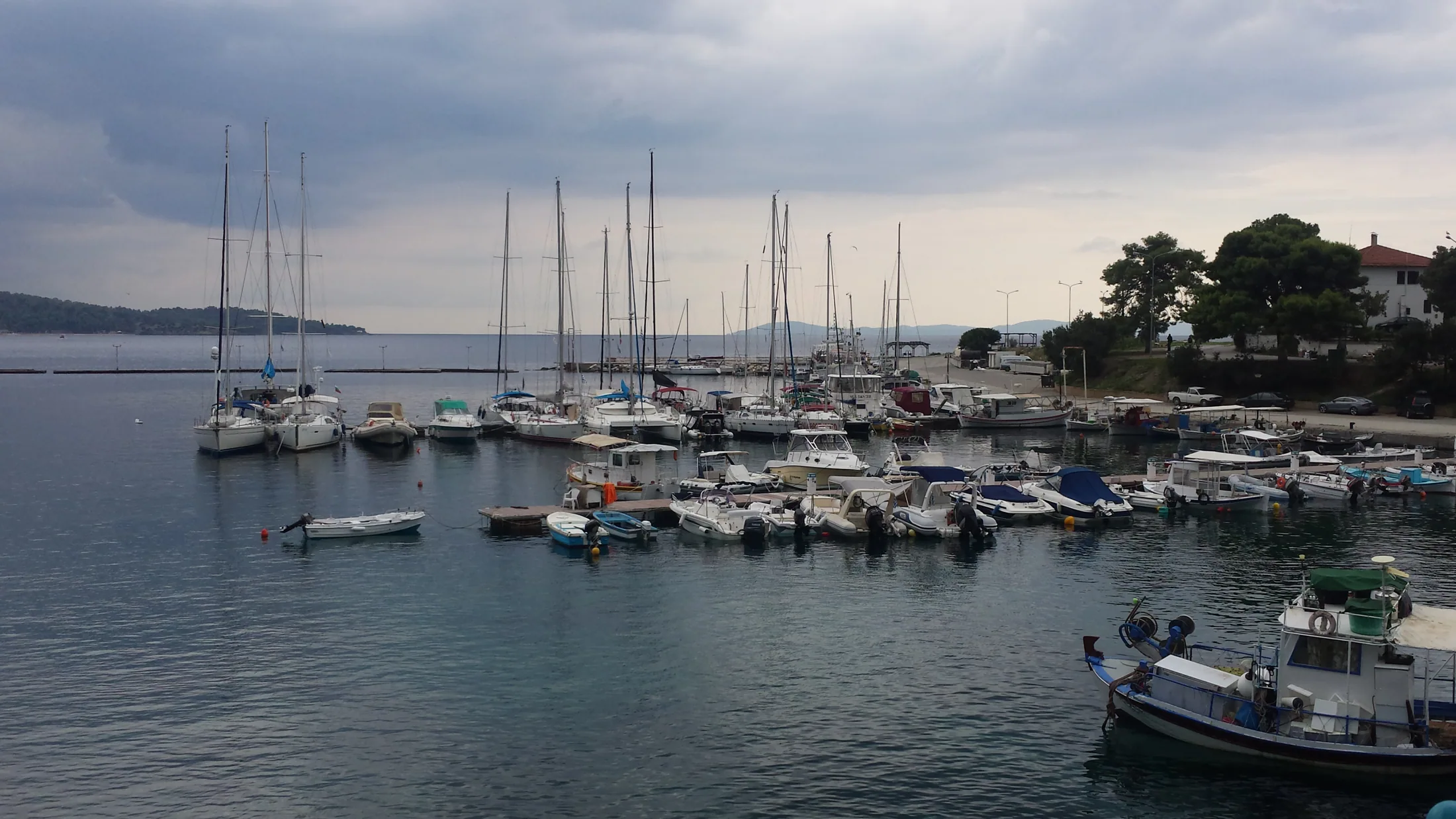 Moored sailing boats in a quiet Halkidiki harbour