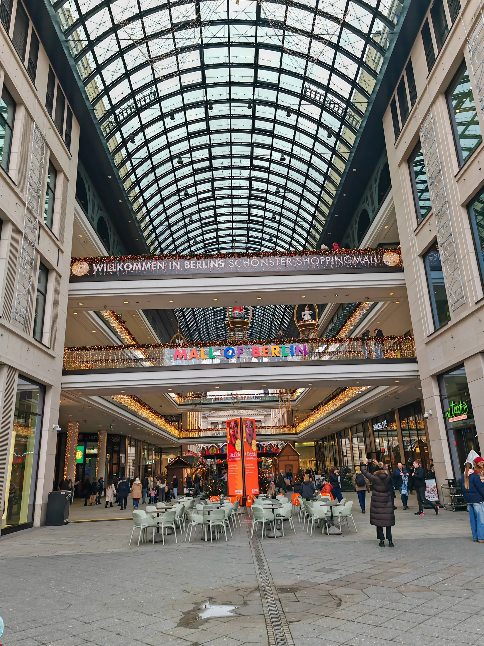 An arched glass roof over a shopping arcade in Berlin