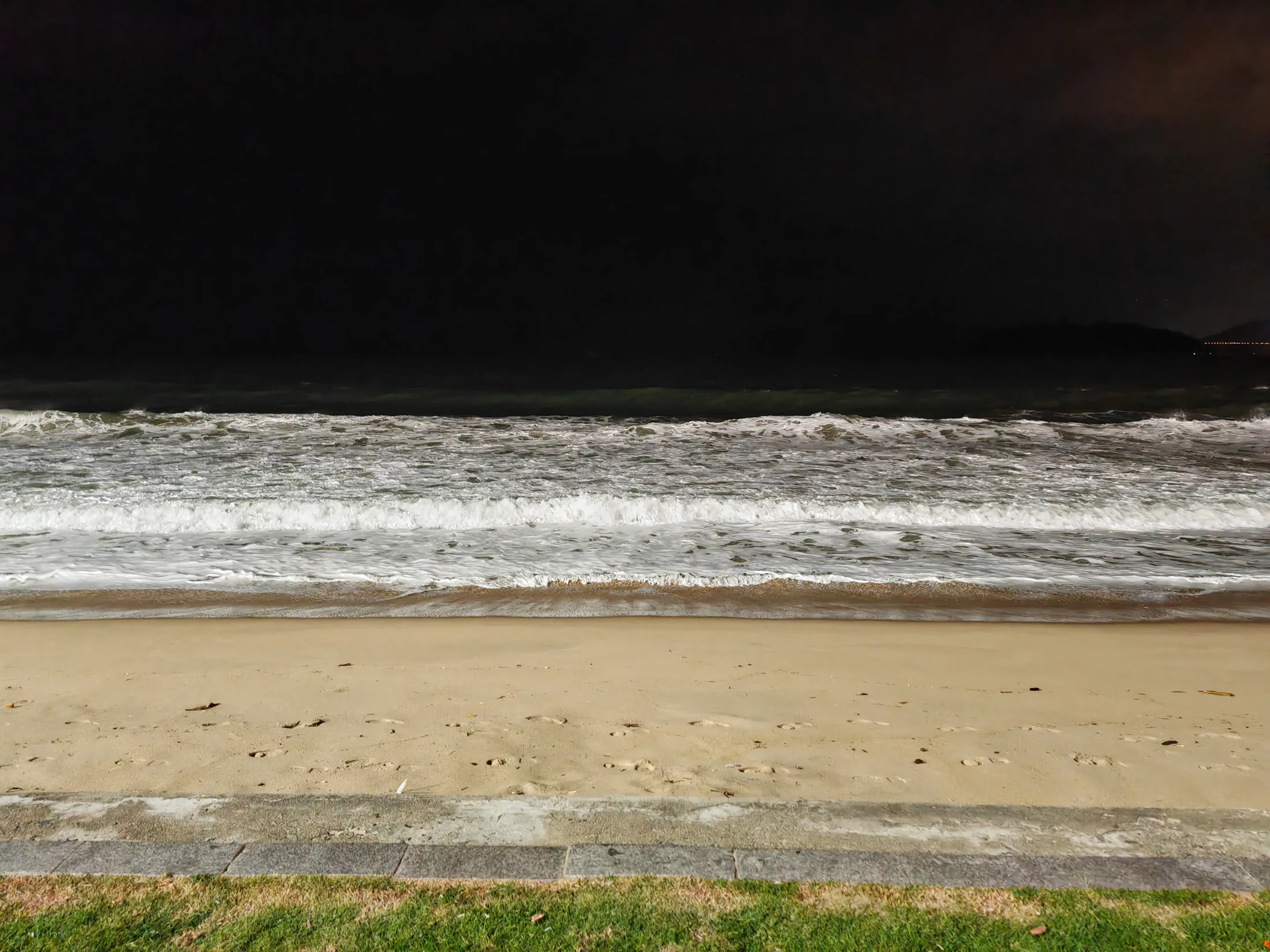 Waves breaking on Nha Trang beach after dark