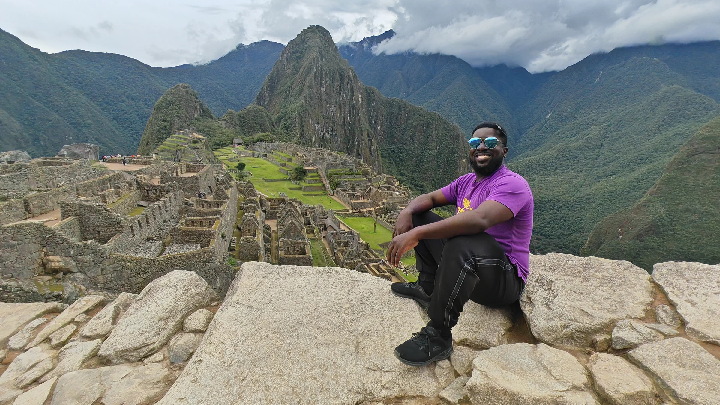 Otis overlooking the ruins and mountains of Machu Picchu